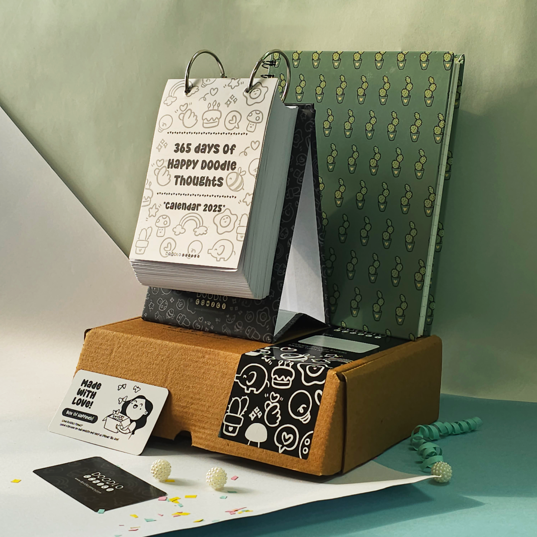 black & white desk calendar with doodle notebook