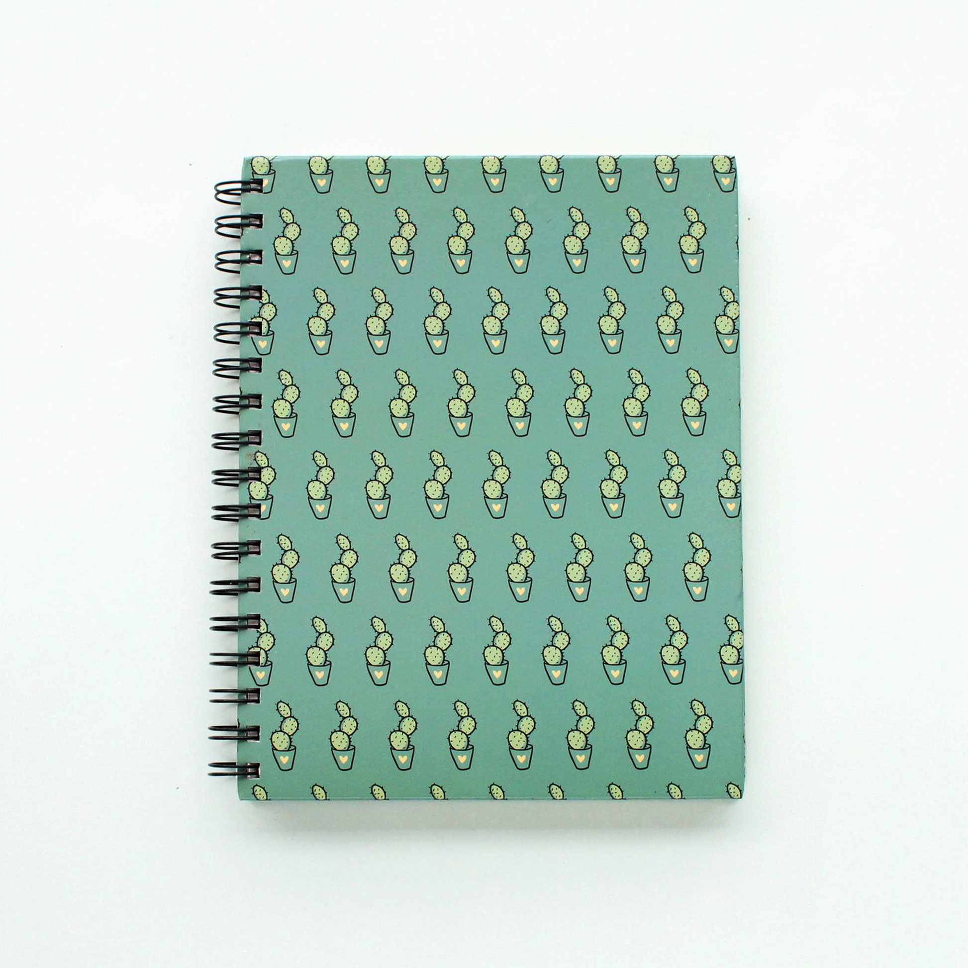 Single spiral notebook of cactus doodle in green
