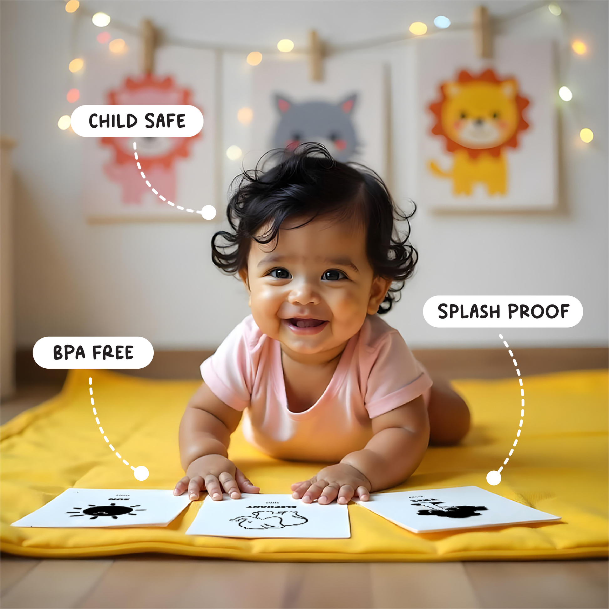 Baby with flash card  playing on yellow mat with cute doodles in background