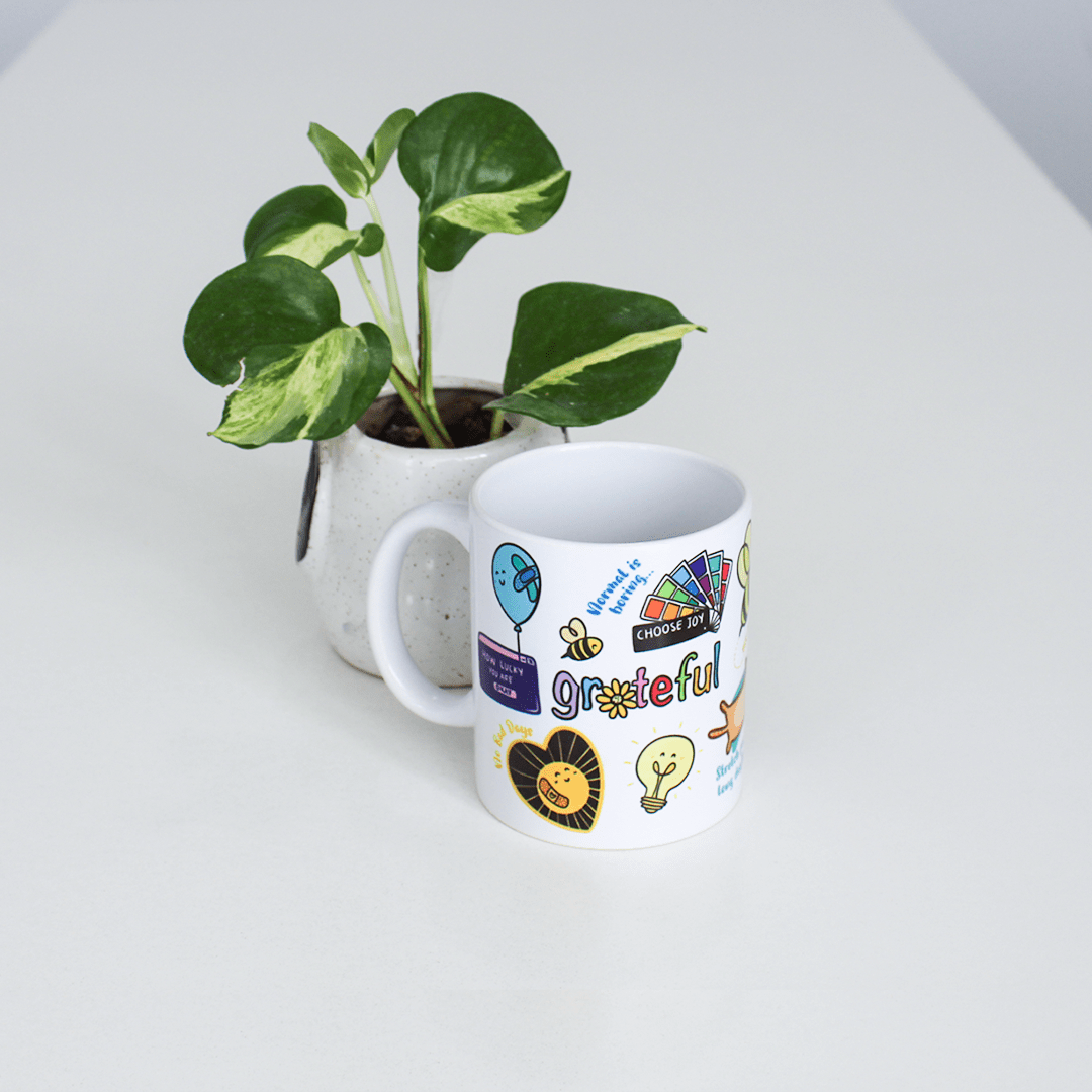 Gratitude-themed ceramic mug with doodle design